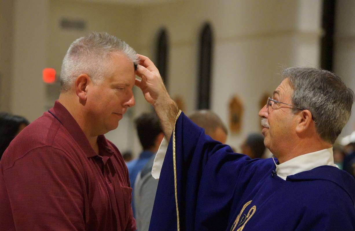 Parishioners at St. Therese Church celebrated Ash Wednesday Mass with pastor Father Mark Lawlor Feb. 14. (Photos by John Cosmas, correspondent)