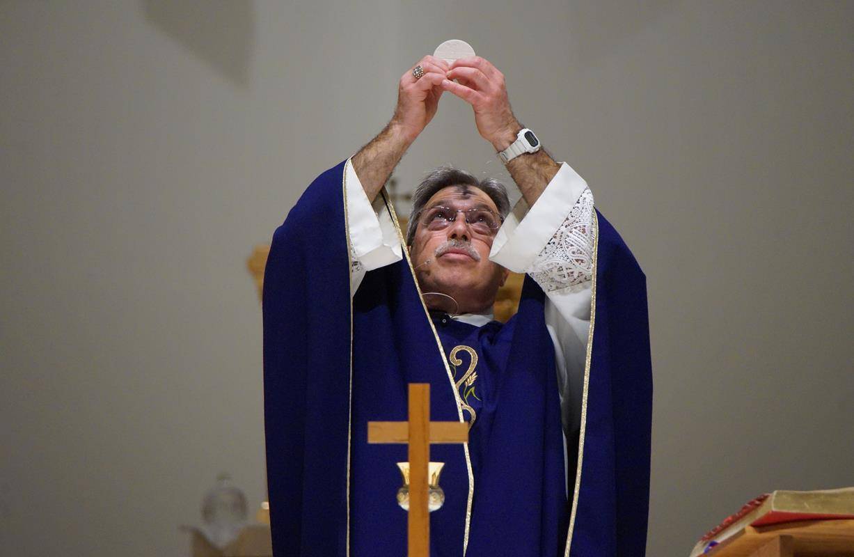 Parishioners at St. Therese Church celebrated Ash Wednesday Mass with pastor Father Mark Lawlor Feb. 14. (Photos by John Cosmas, correspondent)