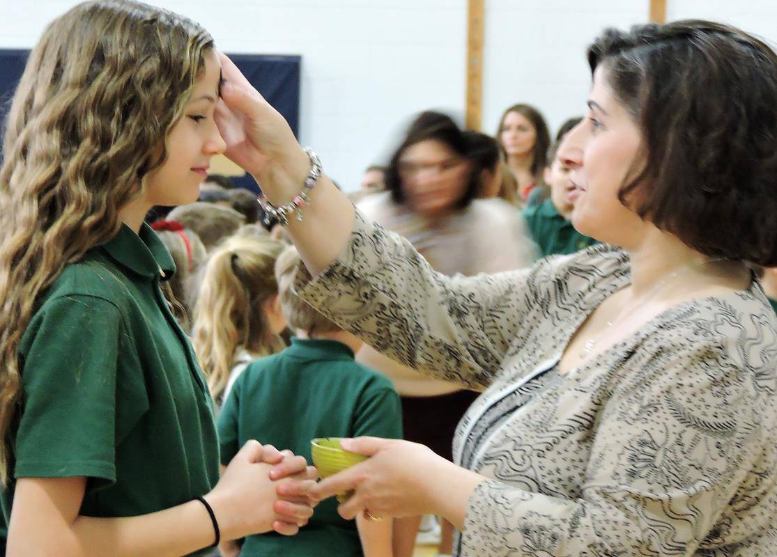St. Mark School students receive ashes during school Wednesday. (Photos provided by Amy Burger)