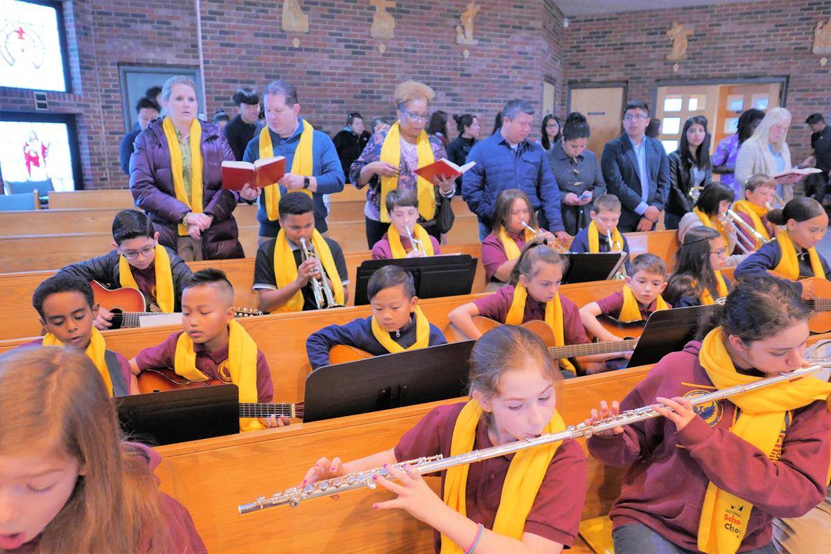 Our Lady of the Assumption School kicked off Catholic Schools Week by taking an active role in the Our Lady of the Assumption Church 11 a.m. Mass. (Photos by Tom Barsanti)