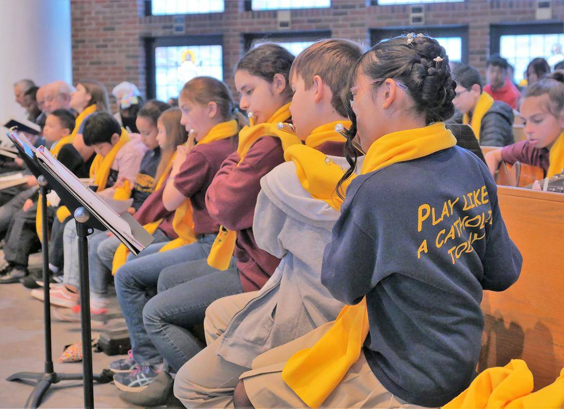 OLA School Band and student guitarists added their talents to the celebration of the Liturgy. (Photos by Tom Barsanti)