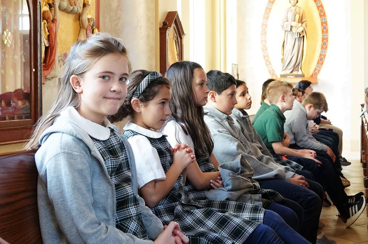 St. Mark School had an all school Mass Jan. 29 to celebrate faith appreciation day for Catholic Schools Week. Father Patrick Winslow, vicar and chancellor of the Diocese celebrated the Mass, which was a votive Mass for St. Joseph (Provided by Amy Burger)