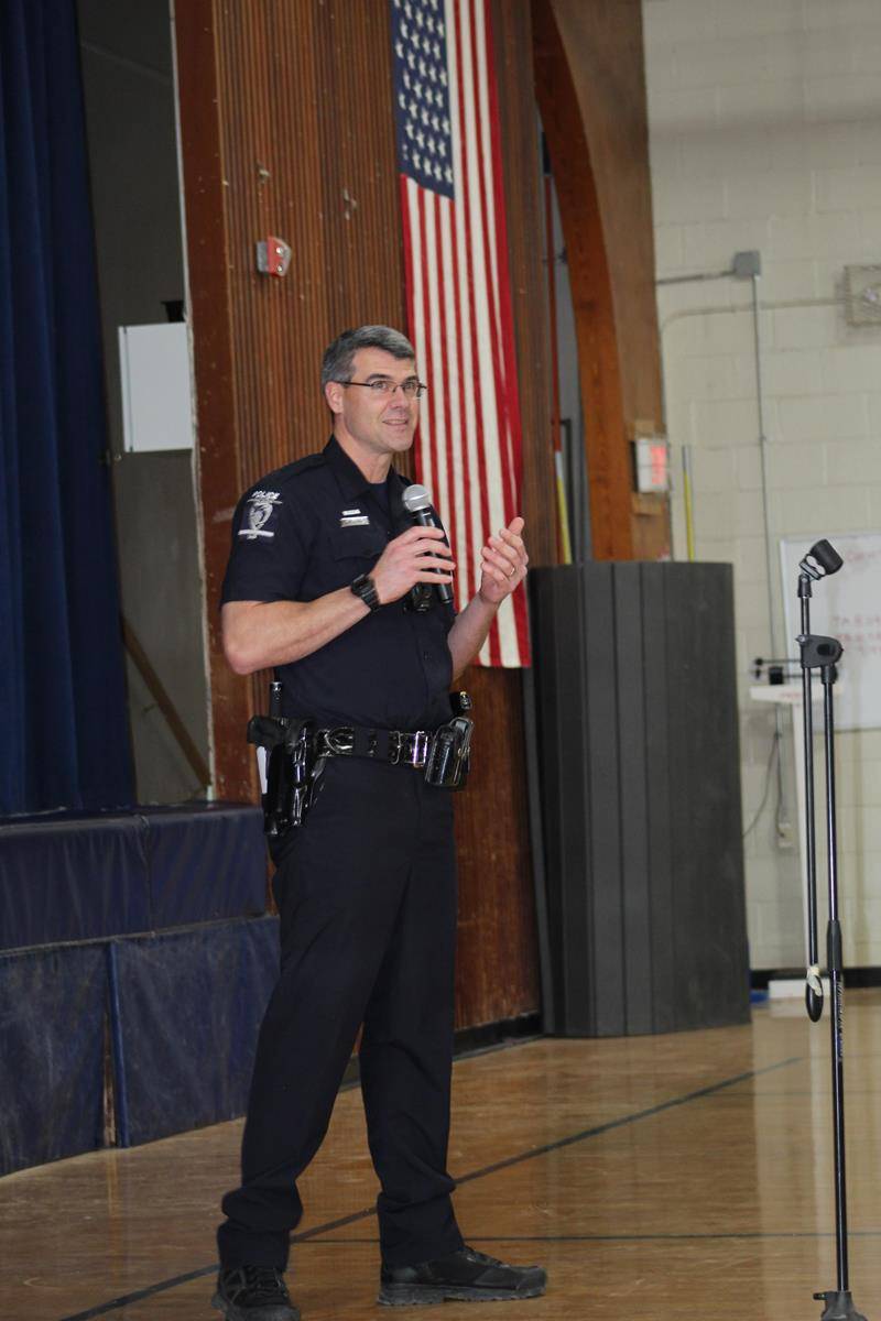 Officer Peter Grant, a Charlotte Catholic High School alum, spoke at a school wide assembly about social media safety. (Photo provided by Lisa Michalski-Gilkey)