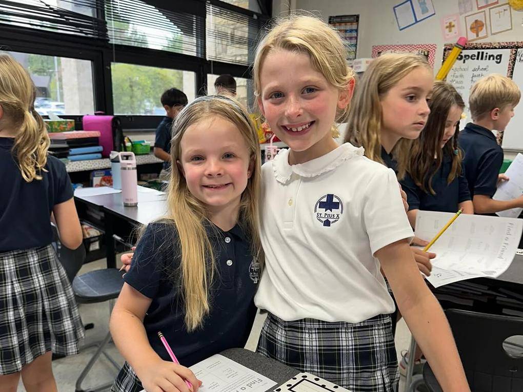 Smiling faces at St. Pius X School in Greensboro.