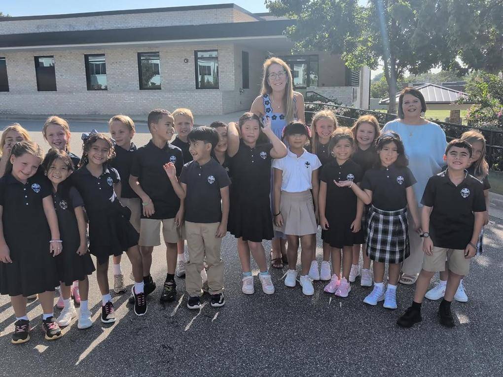 Smiling faces at St. Pius X School in Greensboro.