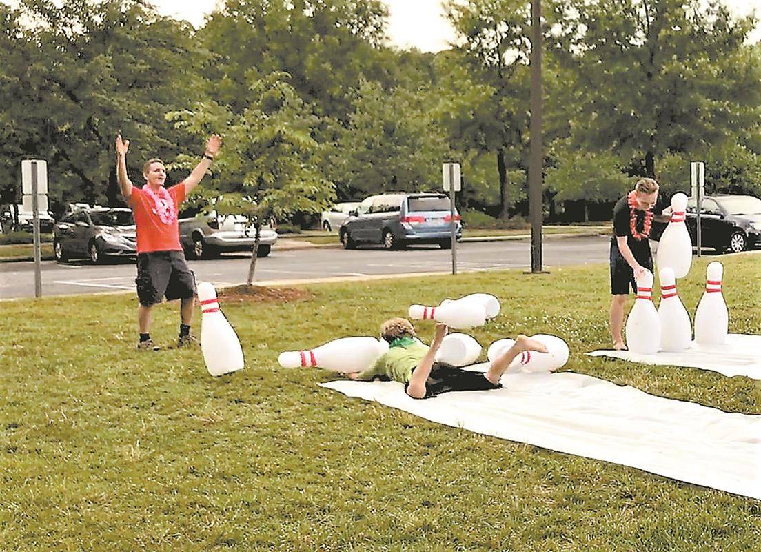 HUNTERSVILLE — (Above and left) Summer Life Teen and other summer youth programs are under way at St. Mark Church, where the high school ministry began the summer by inviting the new rising freshman class to a luau, shaving cream kickball and water slide