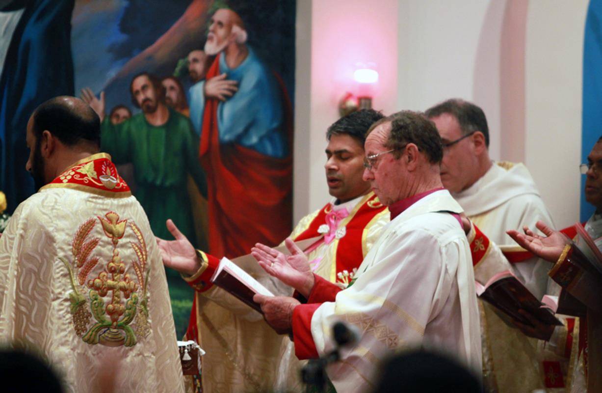 33.	St. Matthew's former pastor Monsignor McSweeney, new pastor Father Pat Hoare, and parochial vicar Father Binoy Davis were among the clergy at the consecration Mass July 22. 