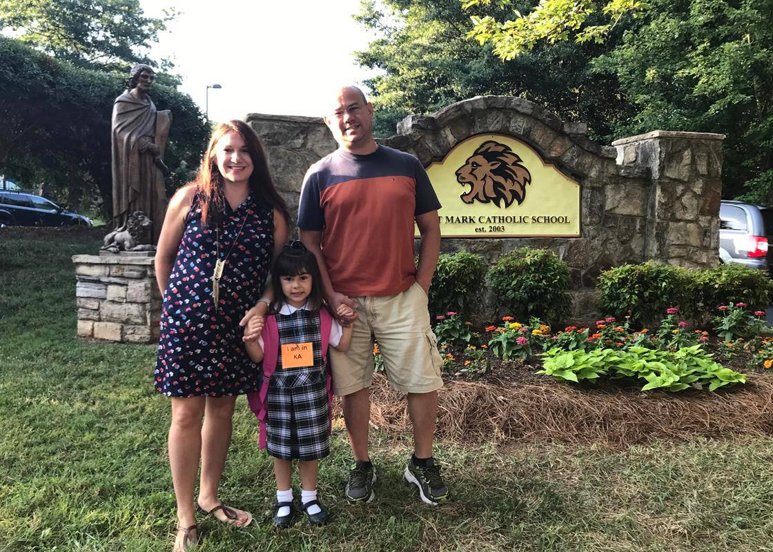 HUNTERSVILLE — Sarah and Rudy Estrada with their daughter Lana as they arrive at St. Mark for their first day of school. (Photo provided by Amy Burger)