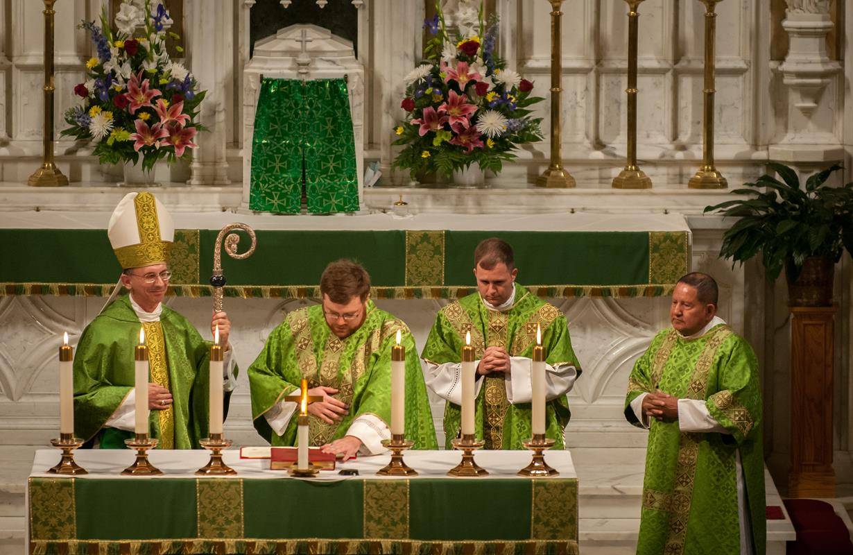 Father Buchanan takes the Oath of Fidelity during his installation as pastor (Photos by Jarek Lucek)