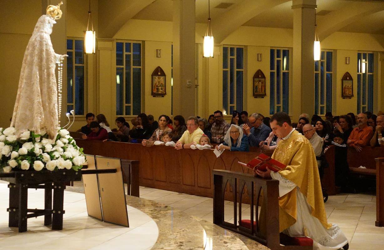 Hundreds of parishioners gathered at St. Mark Church in Huntersville Oct. 13 to welcome one of six Immaculate Heart of Mary statues blessed by Pope Francis.