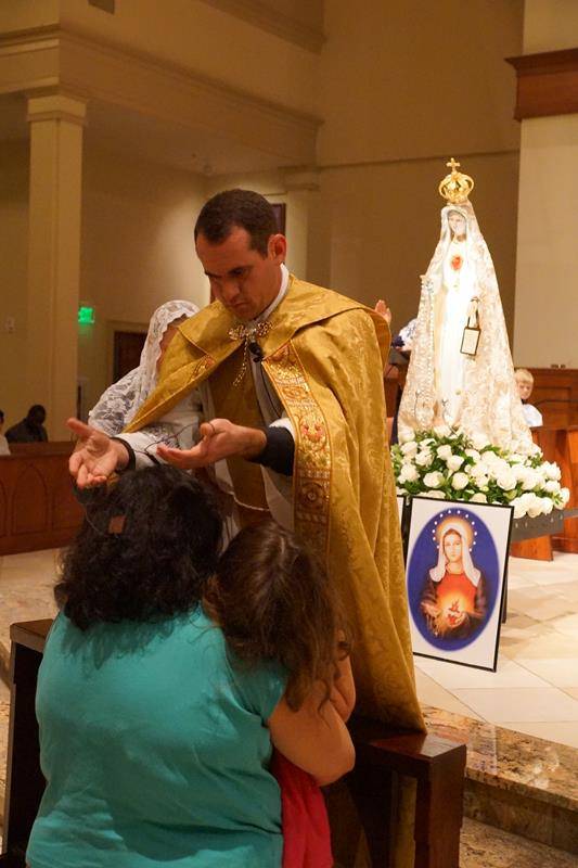 After they prayed the rosary, Mass was celebrated and people had the opportunity to consecrate themselves to the Two Hearts of Jesus and Mary and be invested with the Brown Scapular