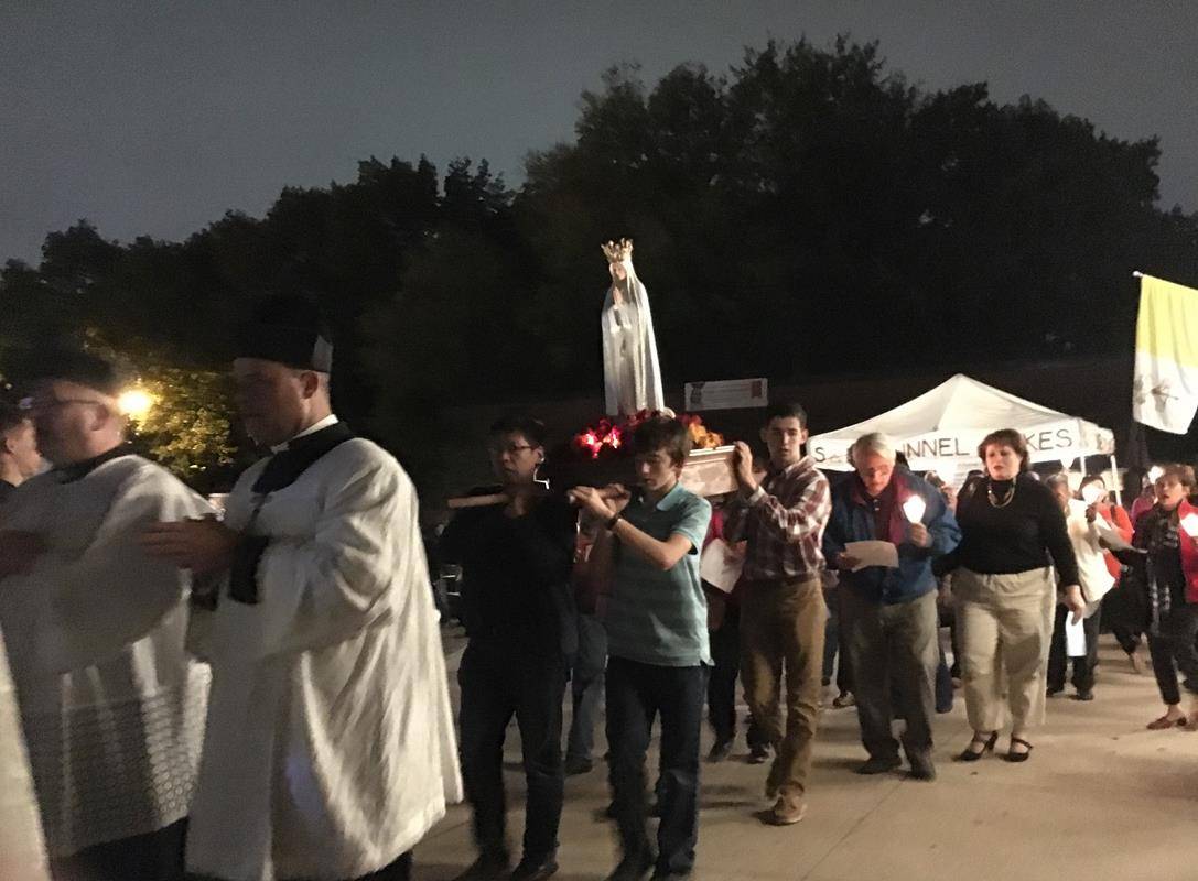 Parishioners at St. Thomas Aquinas Church in Charlotte also gathered to honor Mary as part of church’s monthly Fatima processions on the 13th of every month. Photo by Megan Whiteside, Catholic News Herald