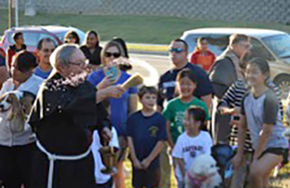 Many families brought their pets to be blessed, including dogs, cats, bunnies, a hamster and two goats. Franciscan Father Joseph Angelini, pastor emeritus, helped in the blessing of animals.