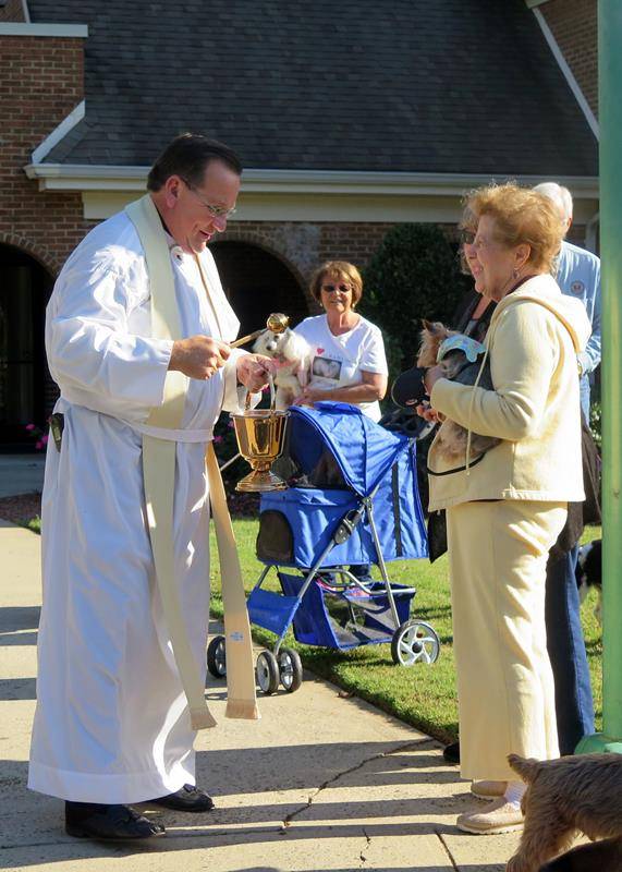 St. Philip the Apostle Church in Statesville held its annual Blessing of Animals ceremony with Father Thomas Kessler, pastor, in front of the church Sept. 30. (Photo provided by Connie Ries)