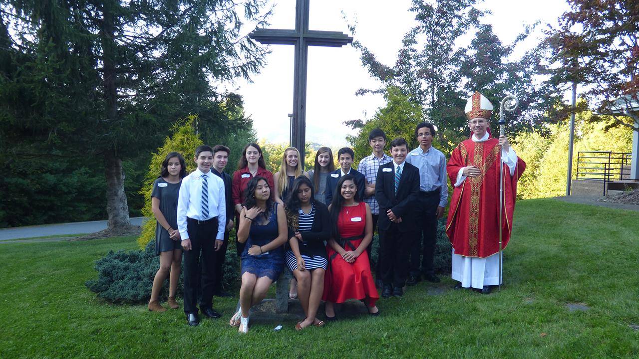 BOONE — Thirteen young people received the sacrament of confirmation from Bishop Peter Jugis at St. Elizabeth Church Sept. 20. (Amber Mellon | Catholic News Herald)