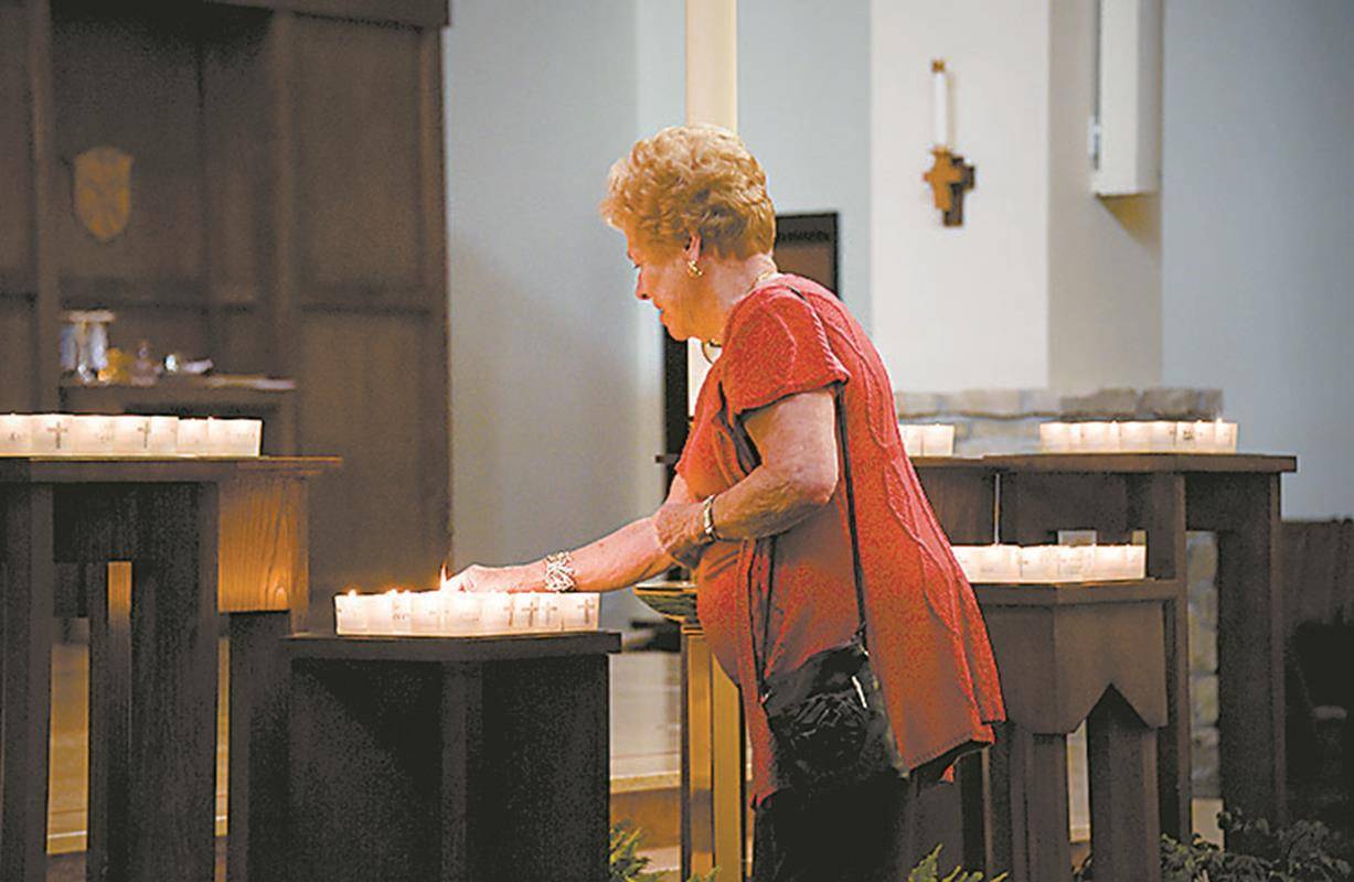 GREENSBORO — People lit candles at an All Souls’ Day Mass at St. Pius X Church.