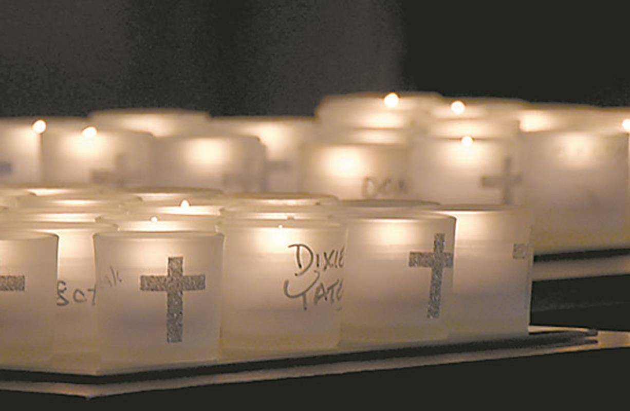 GREENSBORO — People lit candles at an All Souls’ Day Mass at St. Pius X Church.
