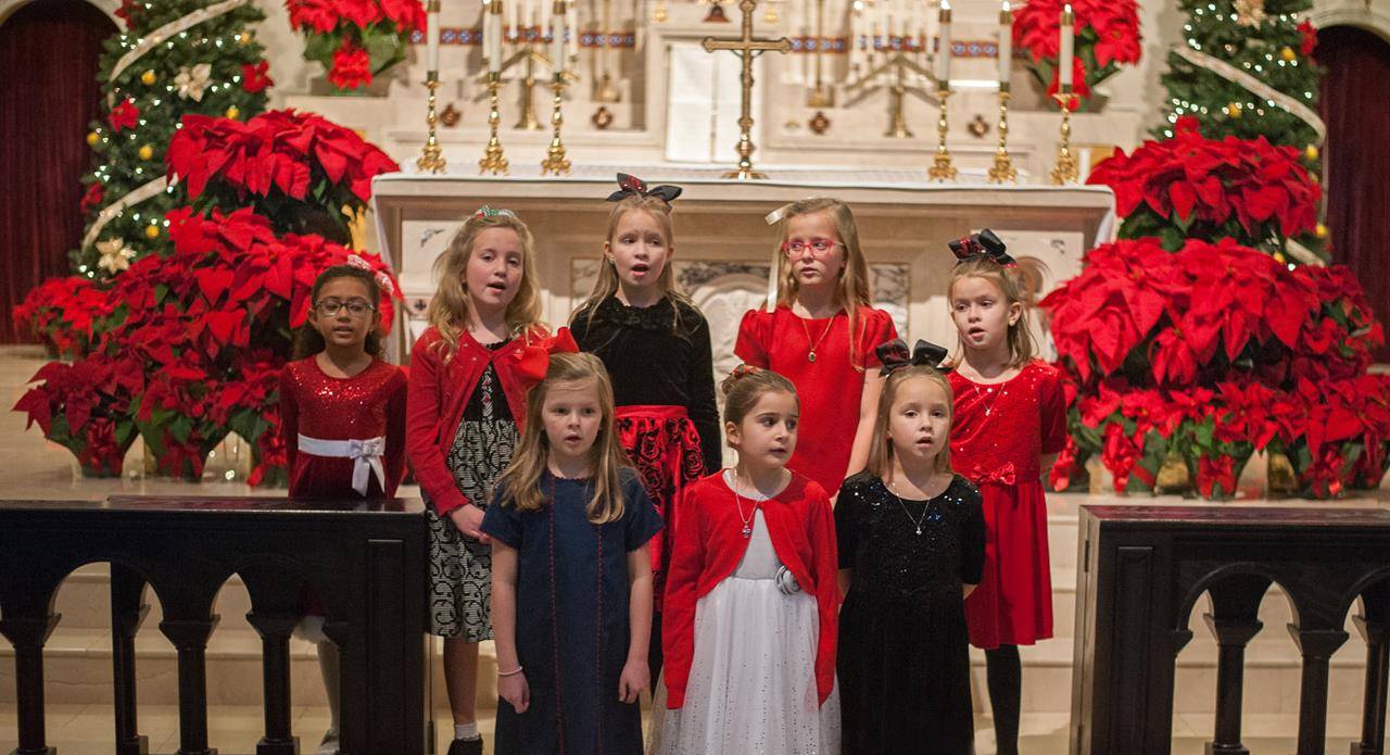 The children’s choir of Sacred Heart Church in Salisbury sang before Mass on Christmas Eve.  (Bill Washington | Catholic News Herald)