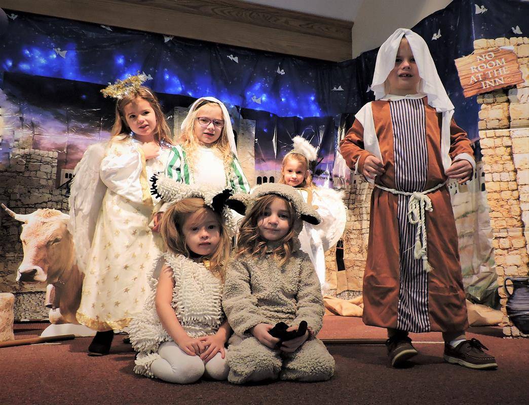 St. Mark Church’s preschool students put on a Christmas Nativity play before the holidays. Pictured are the Inn Keeper, Shepherd, Sheep and Angels. (Photo by Amy Burger)
