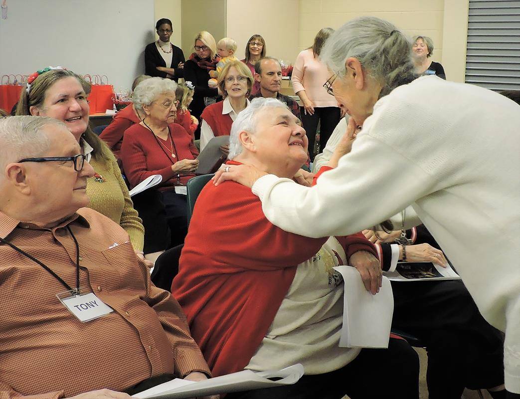 St. Mark Church’s Alzheimer’s Respite Ministry guests and volunteers performed a Christmas handbell and chorus concert for their families, caregivers and staff of the Huntersville parish Dec. 18. 