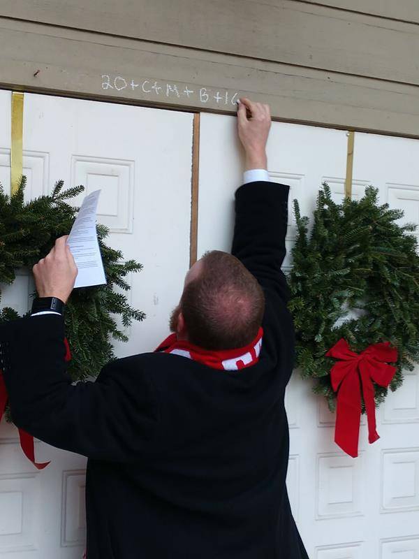 Father Casey Coleman did an Epiphany blessing at St. Mary, Mother of God Church in Sylva. (Della Sue Bryson, correspondent)
