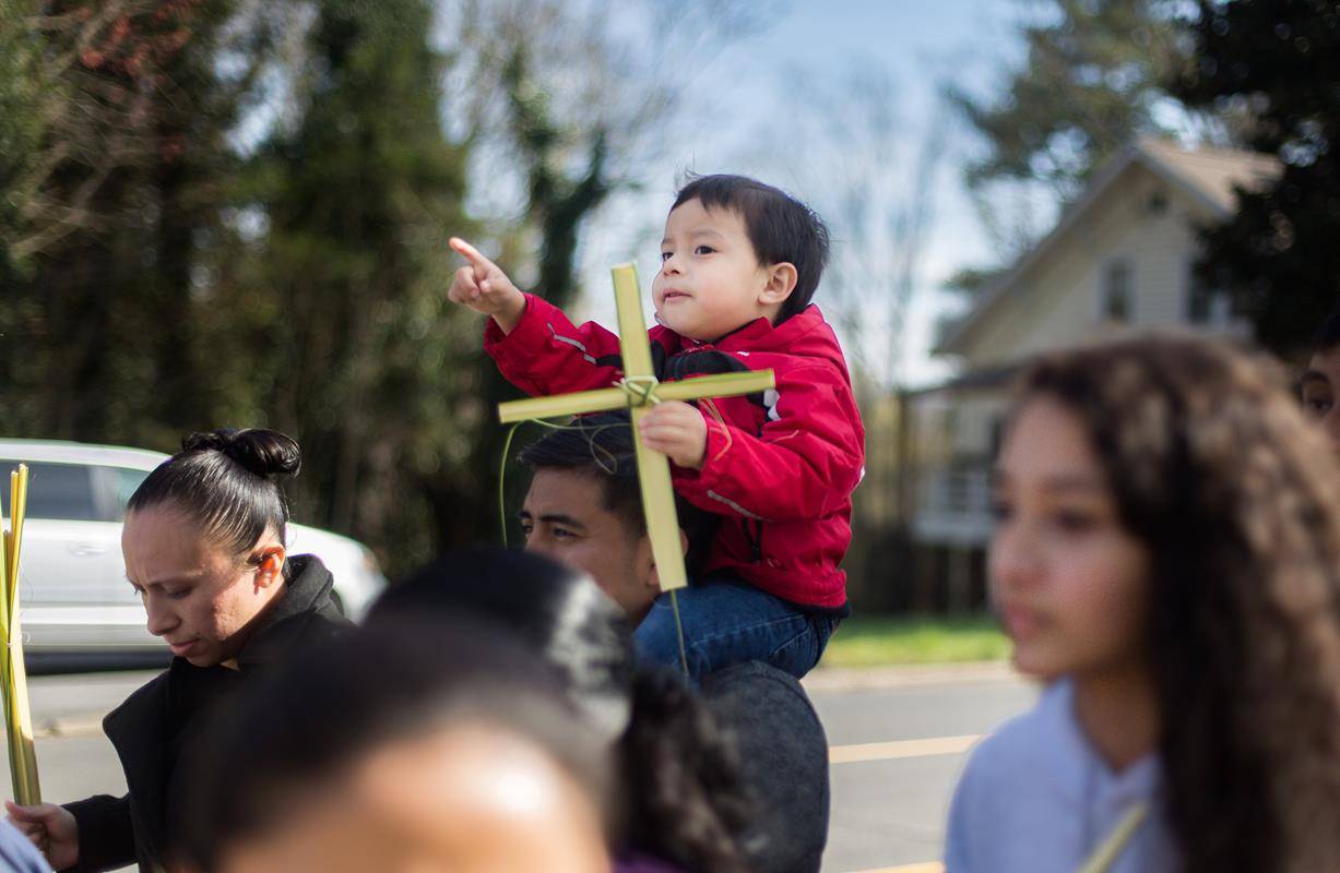 MORGANTON — Members of St. Charles Borromeo Church take part in a Palm Sunday procession March 25. (Photos by Lorenzo Pedro, correspondent)