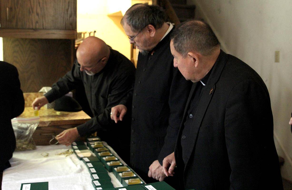 After Mass, deacons divide the blessed oils into smaller oil stocks that are then distributed to all 92 parishes and missions across the diocese for use in sacramental celebrations throughout the upcoming year.