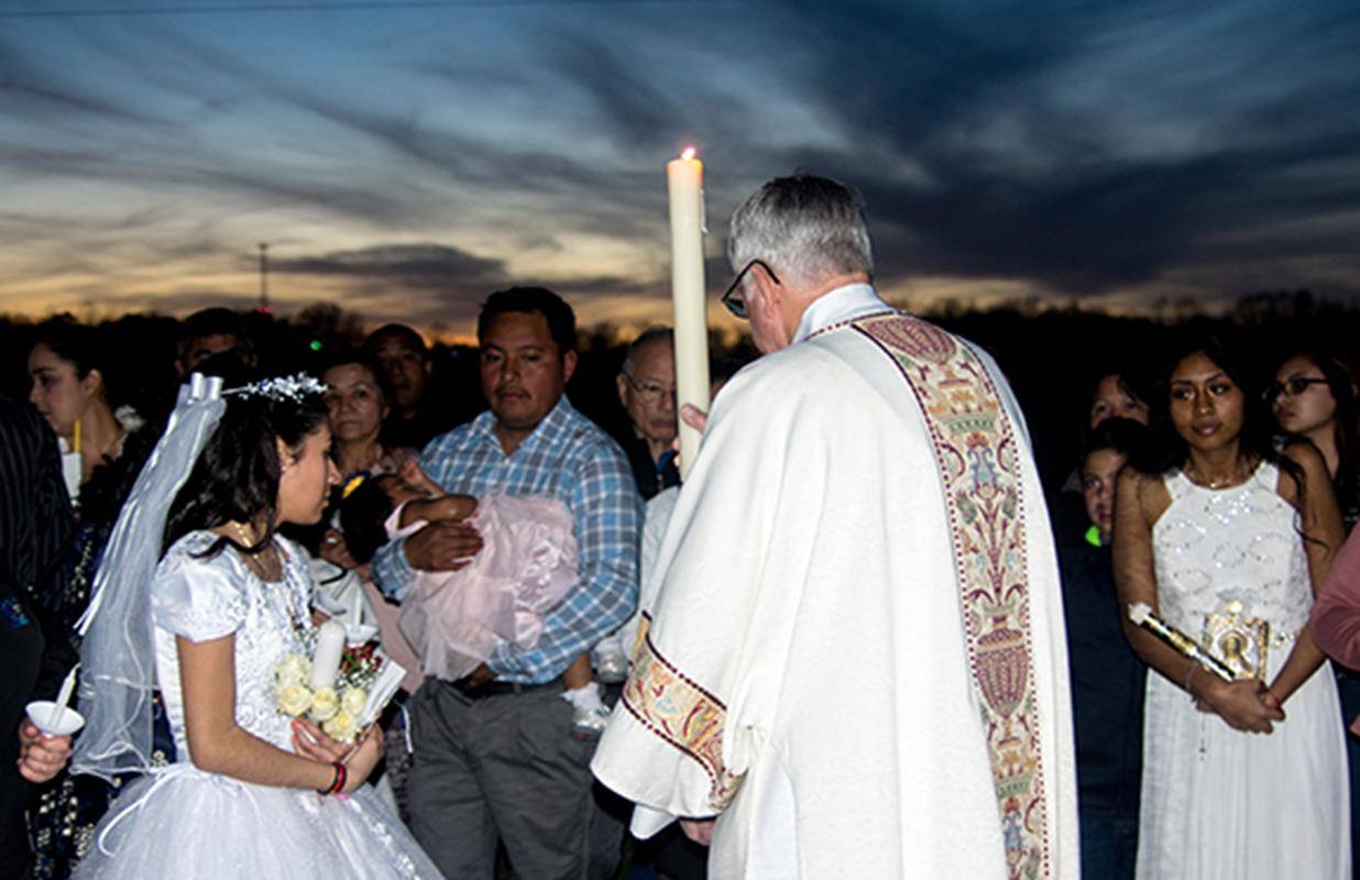 Lighting the Paschal candle outside Our Lady of the Highways Church in Thomasville (Photo by Joe Thornton, correspondent)