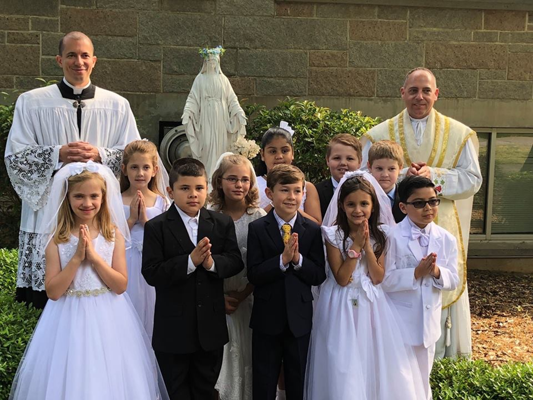 St. Michael School held its May Crowning May 11. Father Matthew Buettner, pastor, and Father Jason Christian led a procession from church to the school’s statue of the Blessed Virgin Mary. (Photo provided by Tammy Eason)