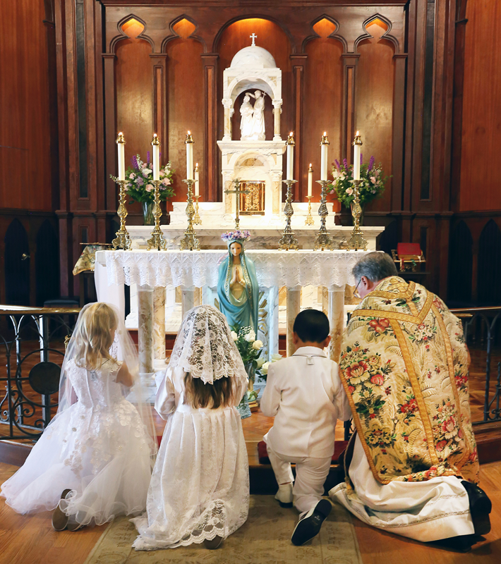 TRYON — First Holy Communion and Crowning of Mary were held at St. John the Baptist Church during the 11 a.m. Mass May 6, offered by Father Roger K. Arnsparger, pastor. (Photos by Giuliana Polinari Riley | Catholic News Herald)