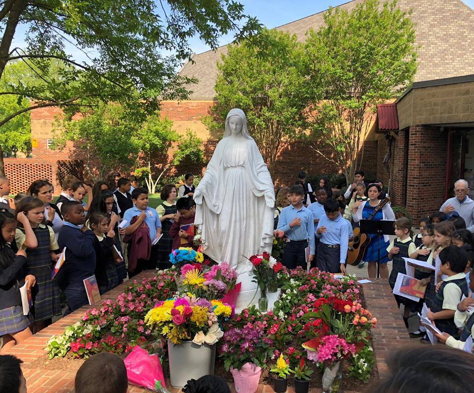 CHARLOTTE — Students at Our Lady of the Assumption School honor Mary for the month of May. (Photo provided by Allana-Rae Ramkissoon)
