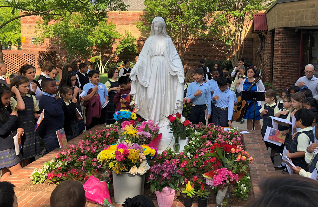 Students at Our Lady of the Assumption School in Charlotte, led by Lupita Sanchez, honored Mary earlier this month with a May crowning. (Photo provided by Allana-Rae Ramkissoon)