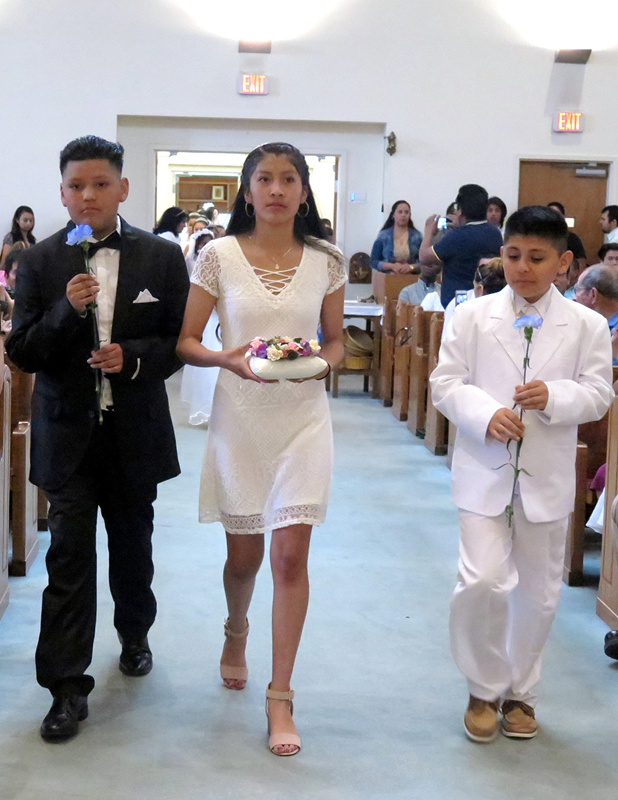 STATESVILLE — Children who received their first Holy Communion at St. Philip the Apostle Church participated in a May Crowning after both the English and the Spanish Masses earlier this month. (Photos provided by Connie Ries)