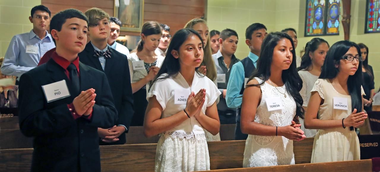 Sixteen young people from St. John the Baptist Church received the sacrament of confirmation from Bishop Peter Jugis June 6