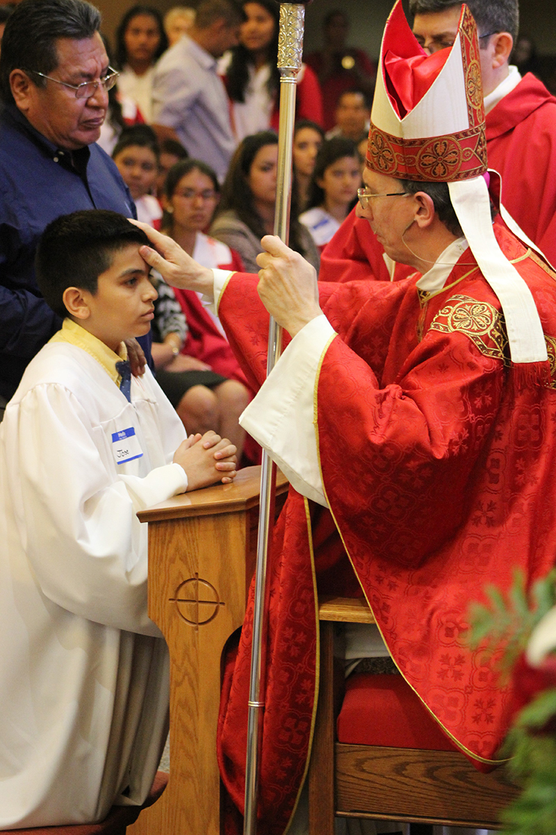 BISCOE — Young people at Our Lady of the Americas Church received the sacrament of confirmation from Bishop Peter Jugis during Mass celebrated July 20. (Photos by Amber Sheriff | Catholic News Herald)
