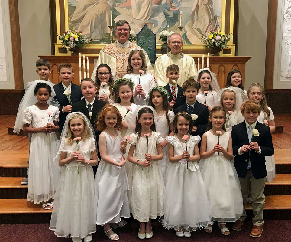 CHARLOTTE — Thirty-five children received their first Holy Communion during two Masses celebrated at St. Peter Church by Jesuit Father James Shea, pastor. (Photos provided by Cathy Chiappetta and Joan Guthrie)