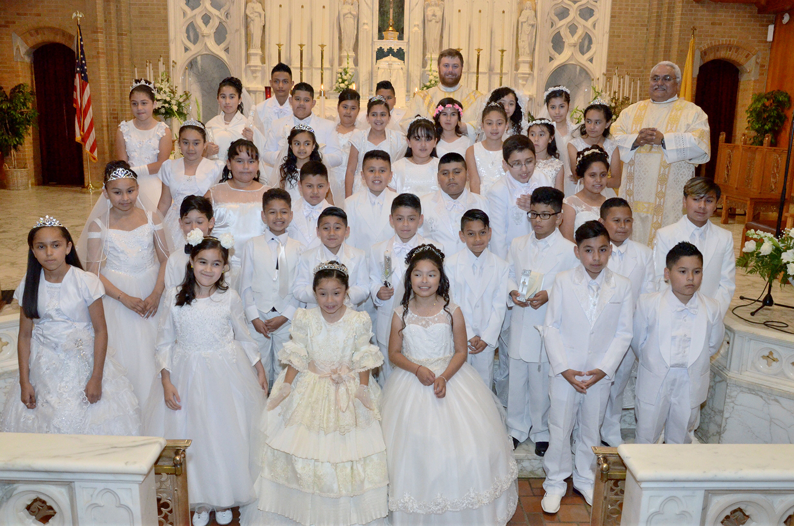 They prepared for the sacrament with the optional Spanish-language faith formation program offered by volunteers in the parish’s Hispanic Ministry.