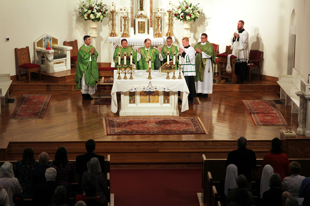 Concelebrating the Mass were Father Christopher Roux, rector; Father Richard Sutter, who formerly served in the U.S. Army (far left); and Father Noah Carter (far right).
