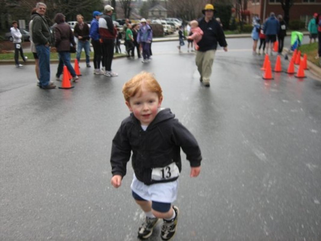 O'Brien and William Edward's first Shamrock Run Fun Run. O'Brien is in the foreground and William Edward is the baby being held in the background.