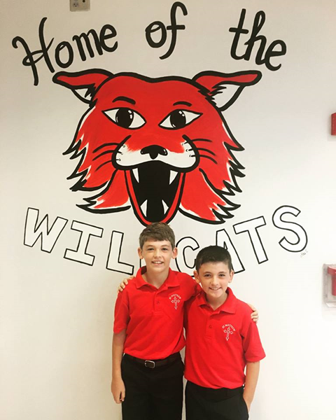 Two enthusiastic elementary students at St. Matthew School in Charlotte are all smiles on their first day of school Aug. 22. Photo courtesy of St. Matthew School Facebook page.