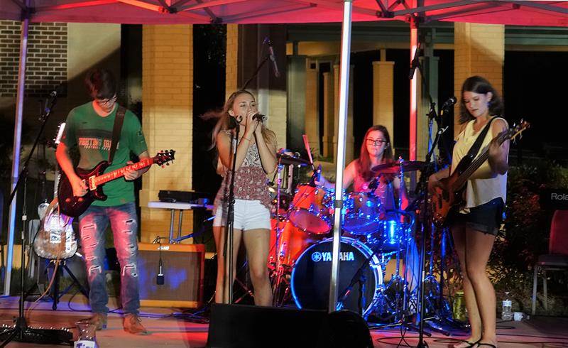 HUNTERSVILLE — Nearly 1,000 people attended “SummerFest,” the annual parish social held Sept. 22 in front of the church. Parishioners listened to music from three bands – St. Mark’s own Psalm 150 Life Teen Band and The Unknown Artist. (Photo by Amy Burger