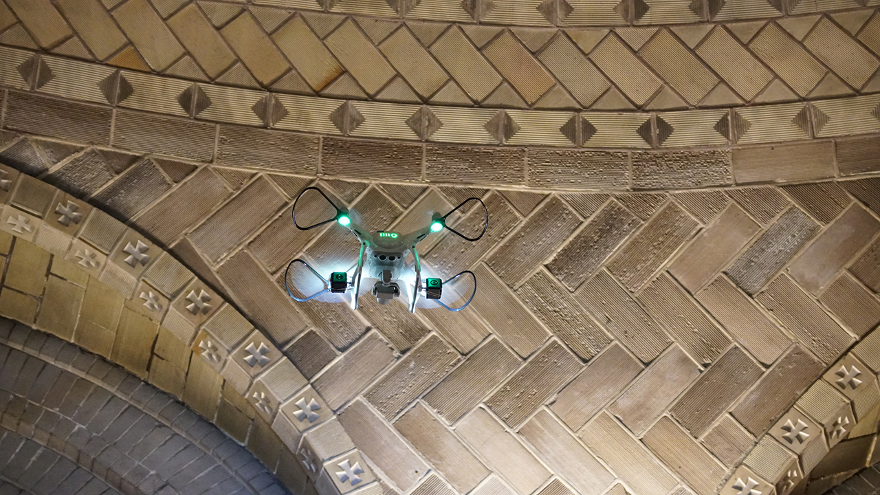 A drone flies high up to the famed dome of St. Lawrence Basilica to get a closer look at the tilework, looking for cracks and moisture damage.