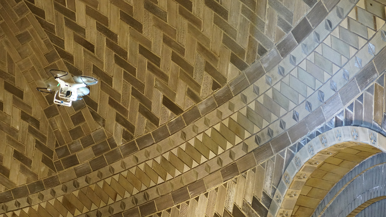 A drone flies high up to the famed dome of St. Lawrence Basilica to get a closer look at the tilework, looking for cracks and moisture damage.