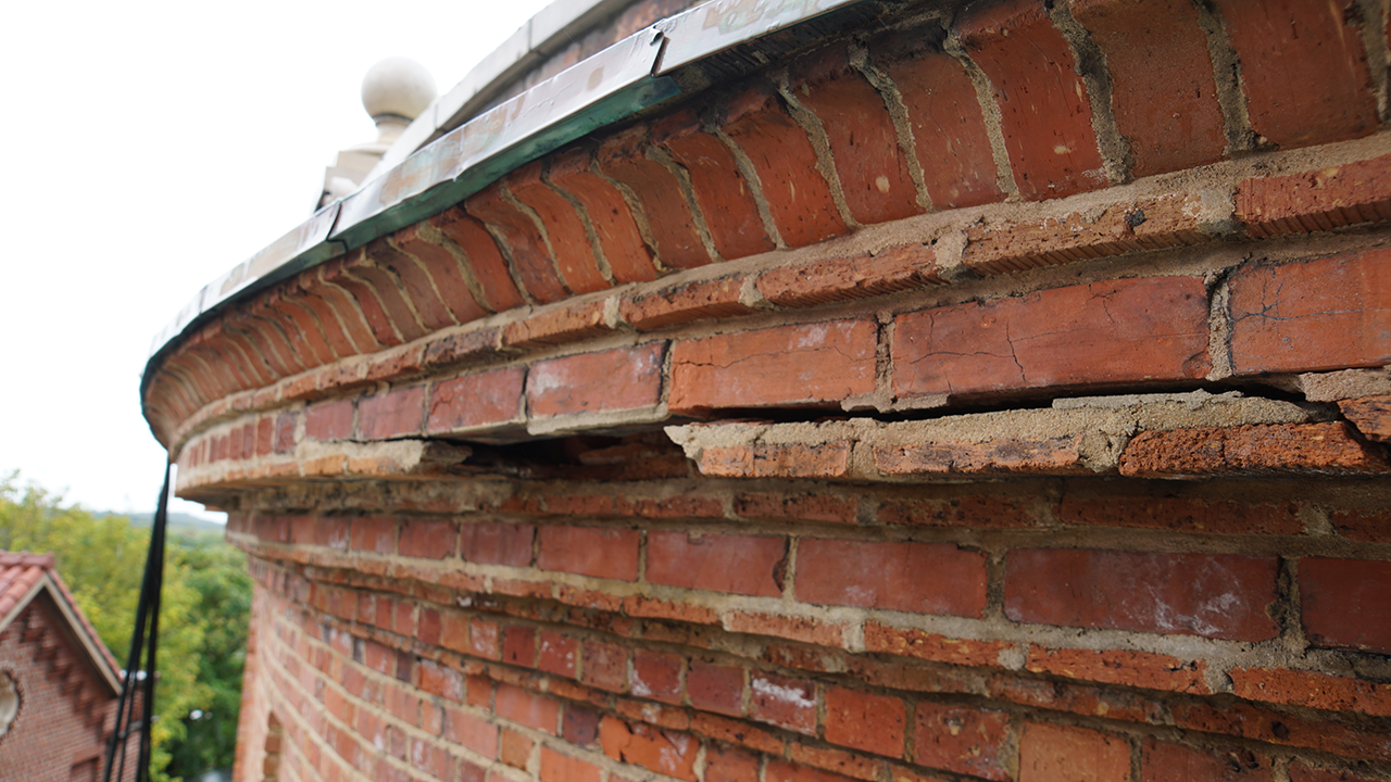 Crumbling bricks are apparent on the exterior of the basilica and its famed dome.