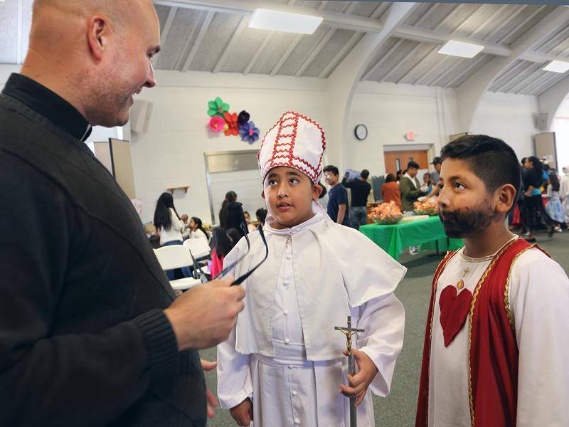 Father Kottar with St. John Paul II and the Sacred Heart.