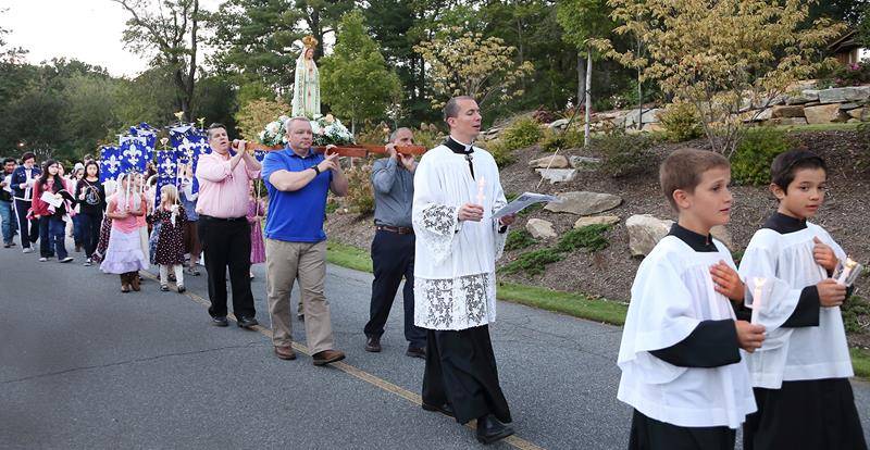 TRYON — On Oct. 13, members of St. John the Baptist Church commemorated the 101st anniversary of the last apparition of Our Lady and the miracle of the sun in Fatima by praying a rosary in front of a statue of Our Lady of Fatima (Giuliana Polinari Riley)