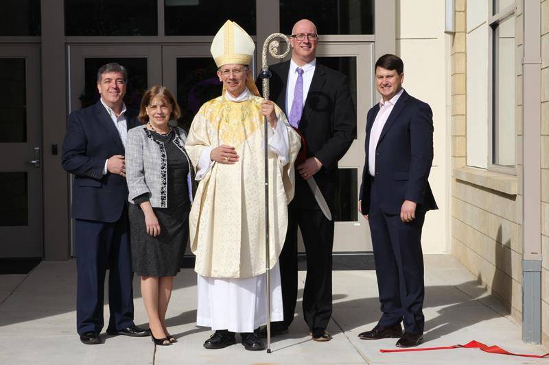 Anthony Morlando, Dr. Janice Ritter, Dr. Carl Semmler and Emmett Sapp are pictured with Bishop Jugis after the ribbon cutting at CTKHS.