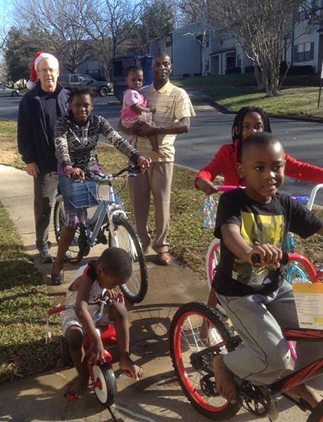 The annual Operation Bikes, sponsored by the parishioners and friends of St. John Neumann Church in Charlotte, had its most successful Christmas season as volunteers delivered 121 bikes and scooters to a lot of excited children. (By Al Tinson)
