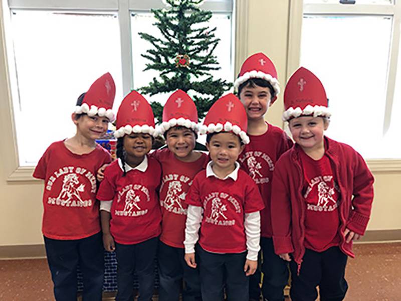 WINSTON-SALEM — Students at Our Lady of Mercy School, particularly the pre-kindergarten students pictured at left, had fun learning about St. Nicholas during a celebration of his feast day Dec. 6. (Photo provided by Katrina Capistrano)