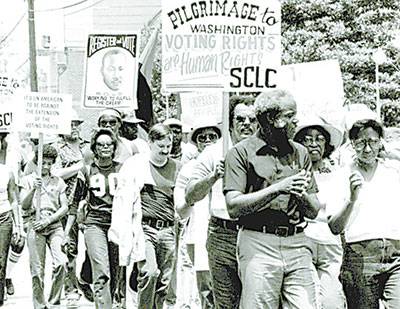 Men and women march for voting rights in this Office of Justice and Peace photo from the early 1980s.